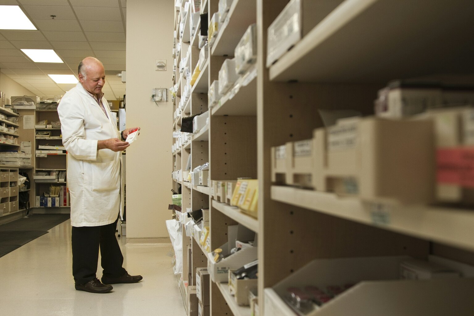 A team member checking a product in the stockroom