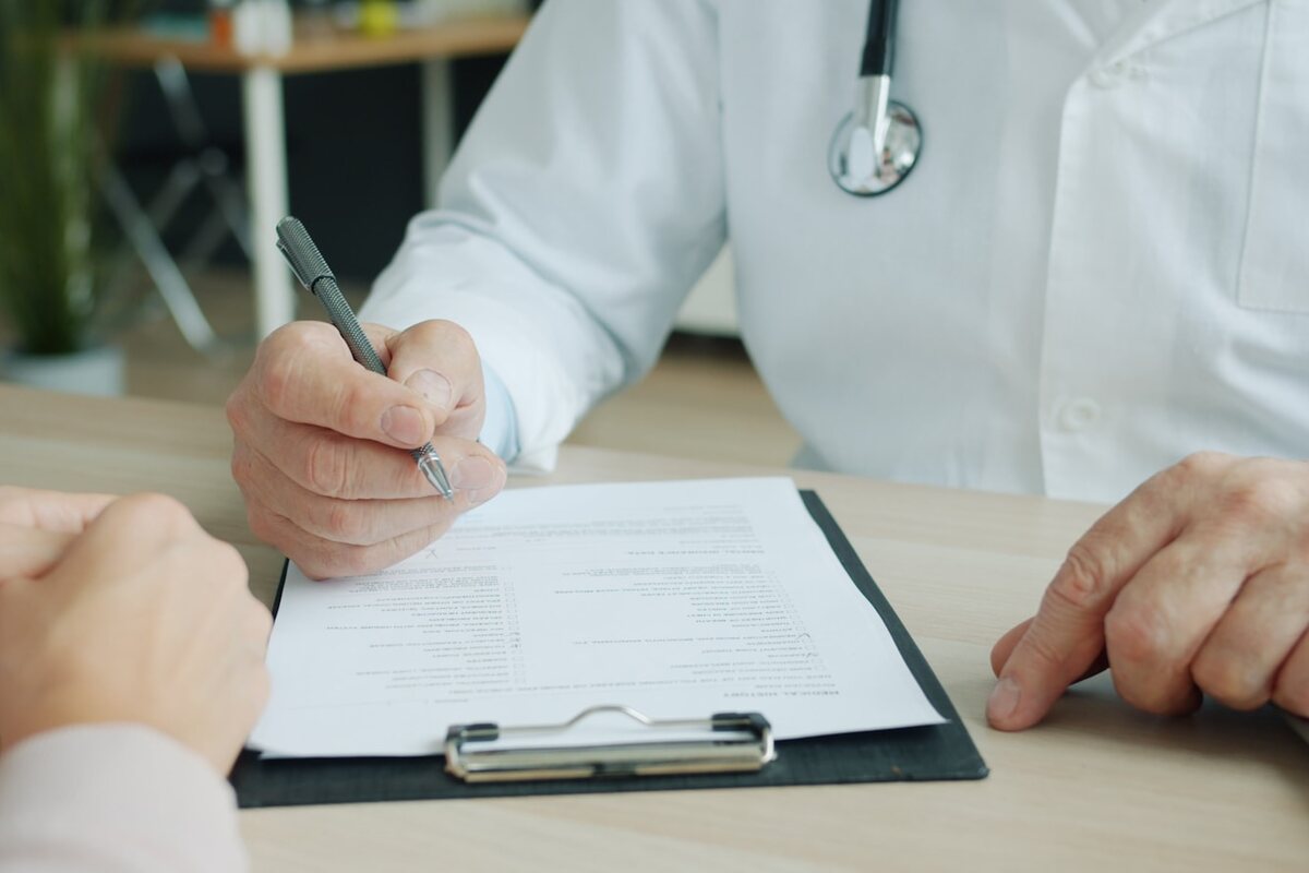 A veterinarian completing a registration form
